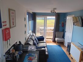 A living room with a sofa and table at Bay View Chalet 2 Bed Sleeps 4 Pets Garden Beach Wilsthorpe near Bridlington