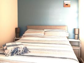 A bedroom with a bed and bedside tables at Bay View Chalet 2 Bed Sleeps 4 Pets Garden Beach Wilsthorpe near Bridlington