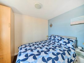 A bedroom with a bed and wardrobe at Bay View Chalet 2 Bed Sleeps 4 Pets Garden Beach Wilsthorpe near Bridlington
