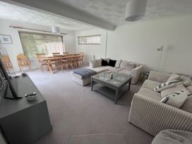 A living room with a dining table and chairs at Sleeps 9 KingBeds Family Friendly, Pityme near Penmayne