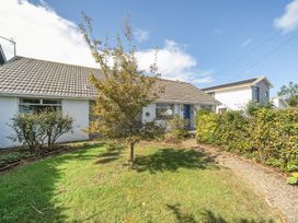A house with a garden and path at Sleeps 9 KingBeds Family Friendly Pityme near Penmayne