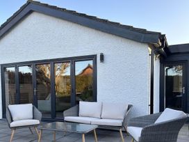 A patio with seating and a table at The Old Barn in Manchester