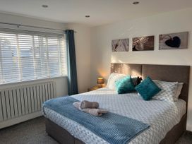 A bedroom with a bed and window at 