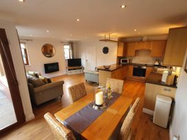 A living room with a dining area and kitchen features at Stunning 2 Bedroom Pet Friendly Lodge in Bridlington