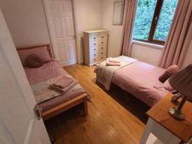 A bedroom with two single beds and a dresser at Stunning 2 Bedroom Pet Friendly Lodge in Bridlington