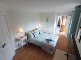 A bedroom with a bed and bedside table at Stunning 2 Bedroom Pet Friendly Lodge in Bridlington