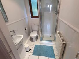 A bathroom with a toilet, sink, and shower at Stunning 2 Bedroom Pet Friendly Lodge in Bridlington