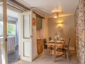 A dining room with a table and chairs at Cosy cottage near scenic walks and country pub, Penrith