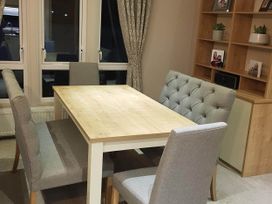 A dining area with a table and chairs at Cayton Bay Lodge Parkdean Resorts in Scarborough