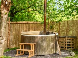 A hot tub in an outdoor area at Sleeps 2 - Private Hot Tub - Fire Pit, St. Dogmaels near Cardigan