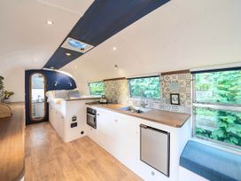 A kitchen with sink and stove at Sleeps 2 - Private Hot Tub - Fire Pit in St. Dogmaels near Cardigan