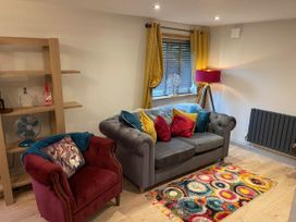 A living room with a sofa and armchair at Luxury 2 bedroom Lodge in rural lincolnshire, Kirton