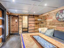 A bathroom with a shower and couch at Luxury 2 bedroom Lodge in rural lincolnshire