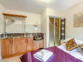A bedroom with a bed and a sink at Luxury 2 bedroom Lodge in rural lincolnshire Kirton