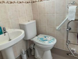 A bathroom with a sink and toilet at Bungalow Sleeps 2 Parking Newquay