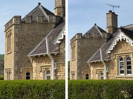 A building exterior with stone walls and a roof at Cotswolds Castle Sleeps 8 with Enclosed Garden in Banbury