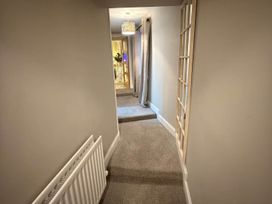 A hallway with carpet and a radiator at 2 Bed Cottage Sleeps 4 Parking Wifi Darnick