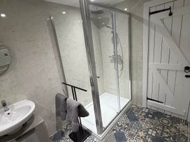 A bathroom with a shower and sink at 2 Bed Cottage Sleeps 4 Parking Wifi Darnick