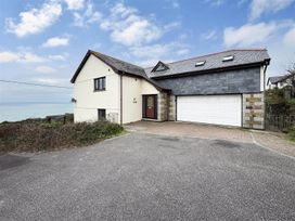 A house with a garage and driveway at Porthleven Coastal Retreat with 5 Bedrooms Porthleven