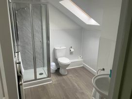 A bathroom with shower and toilet at Porthleven Coastal Retreat with 5 Bedrooms Porthleven