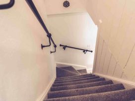 A staircase with a handrail and carpet at 3Bed Cottage Plymouth Dog friendly Sleeps7 Plymouth