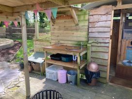An outdoor kitchen area with a sink and counter at The Owl House in countryside setting near Niwbwrch (newborough)