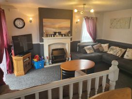 A living room with a sofa and coffee table at The Old Barn in Fleetwood