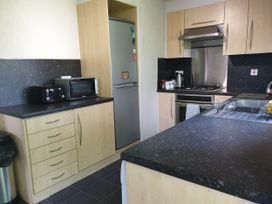 A kitchen with appliances and cabinets at 