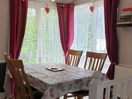 A dining room with a table and chairs at the property in Fleetwood