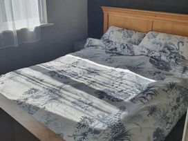 A bedroom with a bed and window at the property in Fleetwood