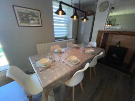 A dining room with a table set for dinner at Tanygrisiau near Blaenau Ffestiniog