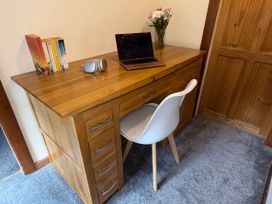 A home office setup with a desk and laptop at Tanygrisiau near Blaenau Ffestiniog