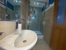 A bathroom with a sink and a shower at Tanygrisiau near Blaenau Ffestiniog