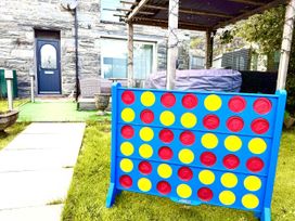 A garden with a game board and a door at Tanygrisiau near Blaenau Ffestiniog