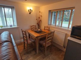 A dining room with a table and chairs at The Old Barn in Hawkshead