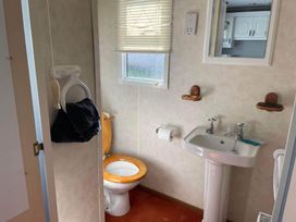 A bathroom with a toilet and sink at 