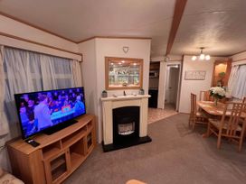 A living room with a television and fireplace at 