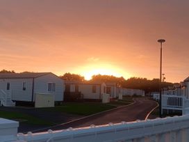 A view of static caravans at sunset near Flookburgh