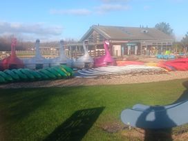 An outdoor area with paddle boats and kayaks at Lake Activities Near Flookburgh