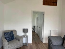 A living room with two armchairs and a table at the property in Bridlington