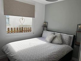 A bedroom with a bed and window at the property in Bridlington