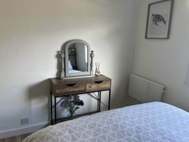 A bedroom with a vanity table and mirror at the property in Bridlington
