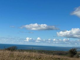 A view of the sea and clouds in the landscape near Nebo near Penygroes