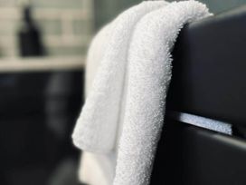 Two towels hanging in a bathroom at 