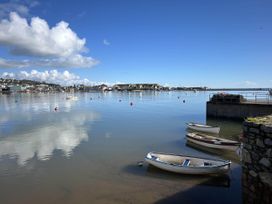 A view of boats on water under a blue sky at Newton Abbot