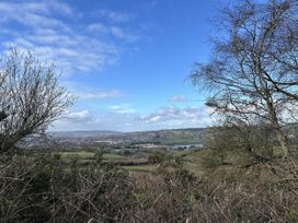 A landscape view with trees and hills at a location in Newton Abbot