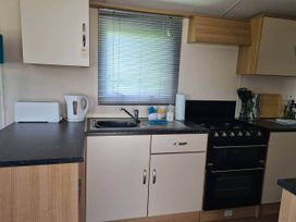 A kitchen with a sink and oven at 