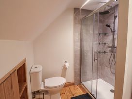 A bathroom with a shower and toilet at The Linhay Cotleigh Nr. Honiton