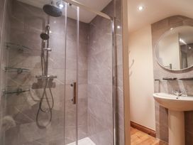 A bathroom with a shower and sink at The Linhay in Cotleigh Nr. Honiton