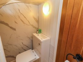 A bathroom with a sink and toilet at Farnecrest in Seahouses